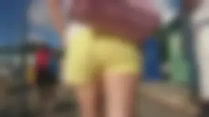 Milf in yellow shorts with vpl and a wedgie