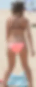 Girl in peach bikini on the beach with a great body and great ass
