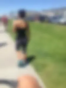 Hot brunette babe in leggings walking her dog with a nice ass and some cleavage