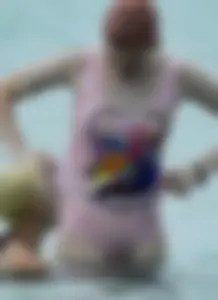 Miley Cyrus' friend in pink see through swimsuit showing nipples and pussy hair