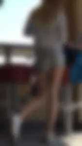 Gorgeous teen in shorts in a cafe