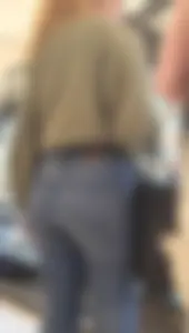 Girl wearing tight blue jeans at the store, closeups of her hot ass