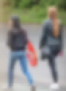 Redhead and ethnic skinny teens in tight jeans