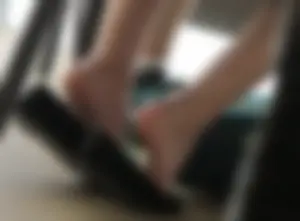 Female Feet With Flats Taken Off Under Table - Photos From College Classroom