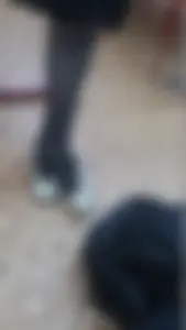 Slim Crossed Legs in Black Pantyhose And Feet in Flat Shoes, Photo in a College Class