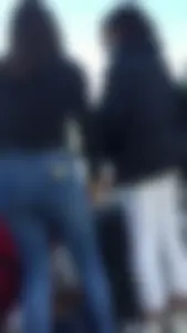 Teen in jeans pants bend over