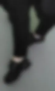 College Teen's Legs in Black Pants And Shoes, Flashing Ankles