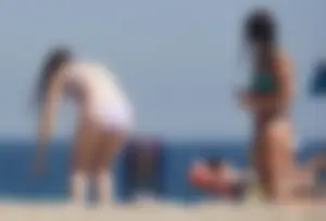 2 cute friends in bikinis on the beach