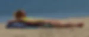Sexy ass blonde milf on the beach in a thong with cameltoe and bending over