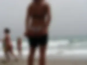 Hot topless girl on the beach in a thong bikini with a nice ass