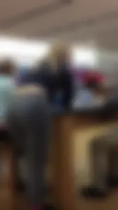 Teen in grey tights and a top bending over