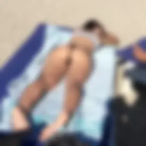 Group of hot candid girls laying on the beach creepshots