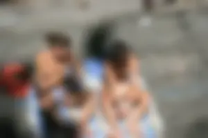 Two teens stripping and going topless to tan