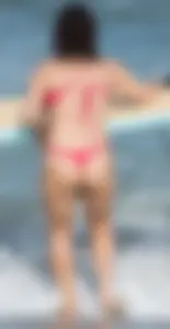 Thick brunette milf on the beach in red thong bikini
