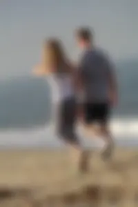 Skinny blonde on the beach in tight grey leggings
