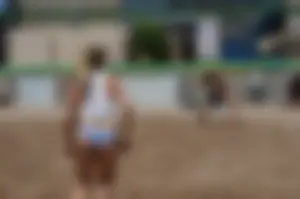 Beach volleyball blonde looking sexy and showing her body off