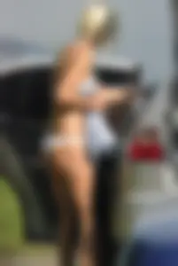 Blonde babe changing into and out of bikini and shows her tits