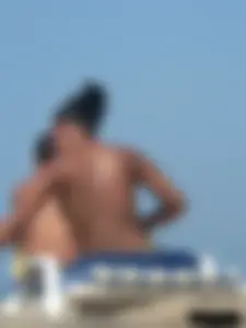 Hot ass topless beach girl with great tits lets her little brother oil up her ass in thong bikini