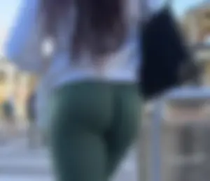 Ebony with a DEEP WEDGIE  in Green Leggings