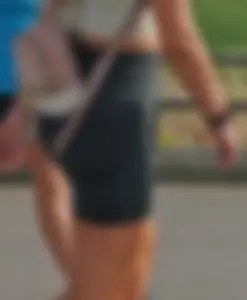 Blonde woman in lycra shorts - good front view, back view ruined by a bag