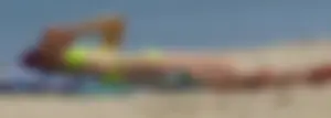 Sexy ass blonde milf on the beach in a thong with cameltoe and bending over