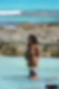 Nude beach ladies in the water showing their tits