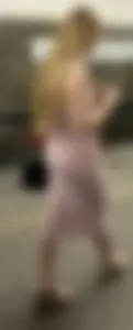 Blonde college girl with a baby face in a very tight dress