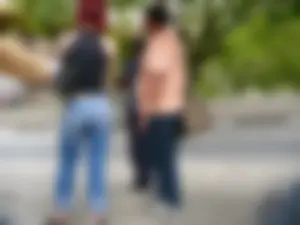 Red haired lady with a nice ass in tight jeans waiting for the bus