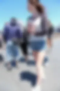 Cute girl walking in short jean shorts