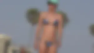 Group of sexy beach girls in bikinis playing