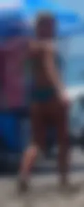 Sexy blonde on the beach in a teal thong bikini with nice ass