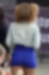 Mixed race woman in spandex shorts outfit