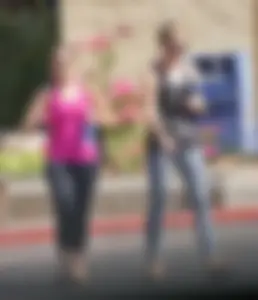 Skinny blonde in grey leggings with a friend