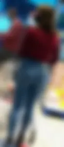 Hot bubble booty in tight jeans, girl wearing a mask at the supermarket