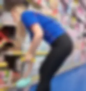 Blonde bending in tight leggings