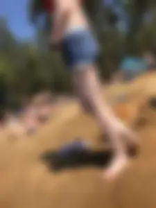 Skinny Barefoot Girl in Swimsuit and Shorts at the Beach Candid Photo Gallery