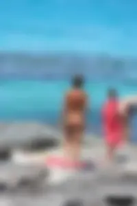 Older lady on a nude beach showing her body