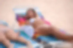 Assortment of sexy babes at the beach in bikinis