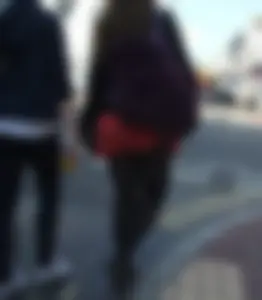 Girl in a pink skirt and stockings accidentally showing some cheek