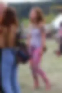 Cute hippie chick in tank top with no bra showing pokies