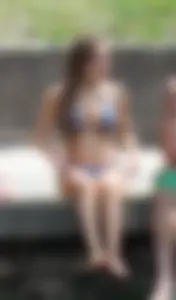 Sexy girl at the pool in a bikini with great tits
