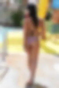Hot little brunette babe in her bikini at the waterpark