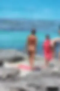 Older lady on a nude beach showing her body