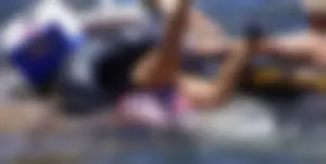 Sexy party girls in bikinis on a lake