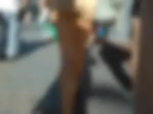 Brunette ass cheeks in short yellow shorts