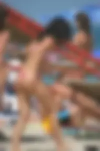 A bunch of sexy beach voyeur babes in bikinis, thongs and topless
