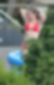 Thick babe in the backyard in red bikini