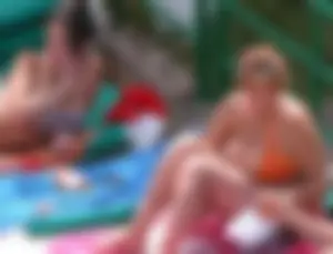 Sexy pool teen with big boobs barely staying in her top