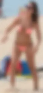 Girl in peach bikini on the beach with a great body and great ass