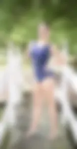Cute non-candid teen gymnast showing off her stretch on a pier